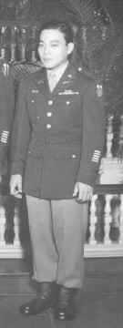 A full body shot of Chiyoki Ikeda in uniform.