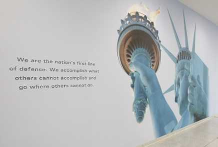 Image of a wall from the CIA Museum featuring the Statue of Liberty.