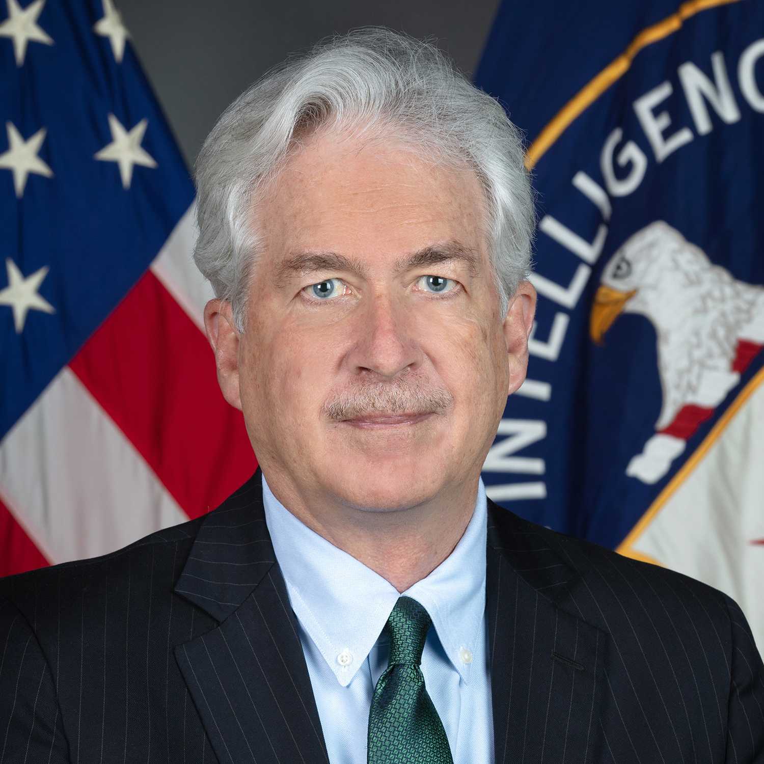 DCIA William Burns portrait with both American and CIA flags in background.
