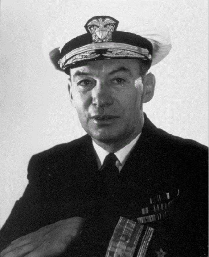 Black and white headshot of a man in uniform.