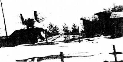 Blurry black and white photo of a field.