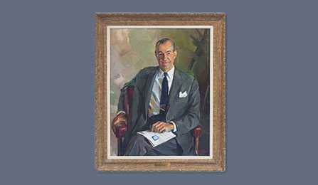 A portrait of former CIA director Richard M. Helms in a gold frame.
