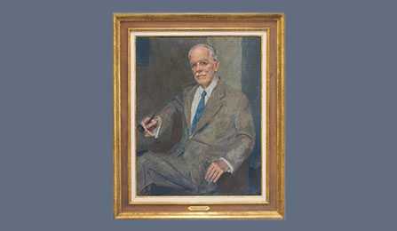 A portrait of former CIA director Allen W. Dulles in a gold frame.