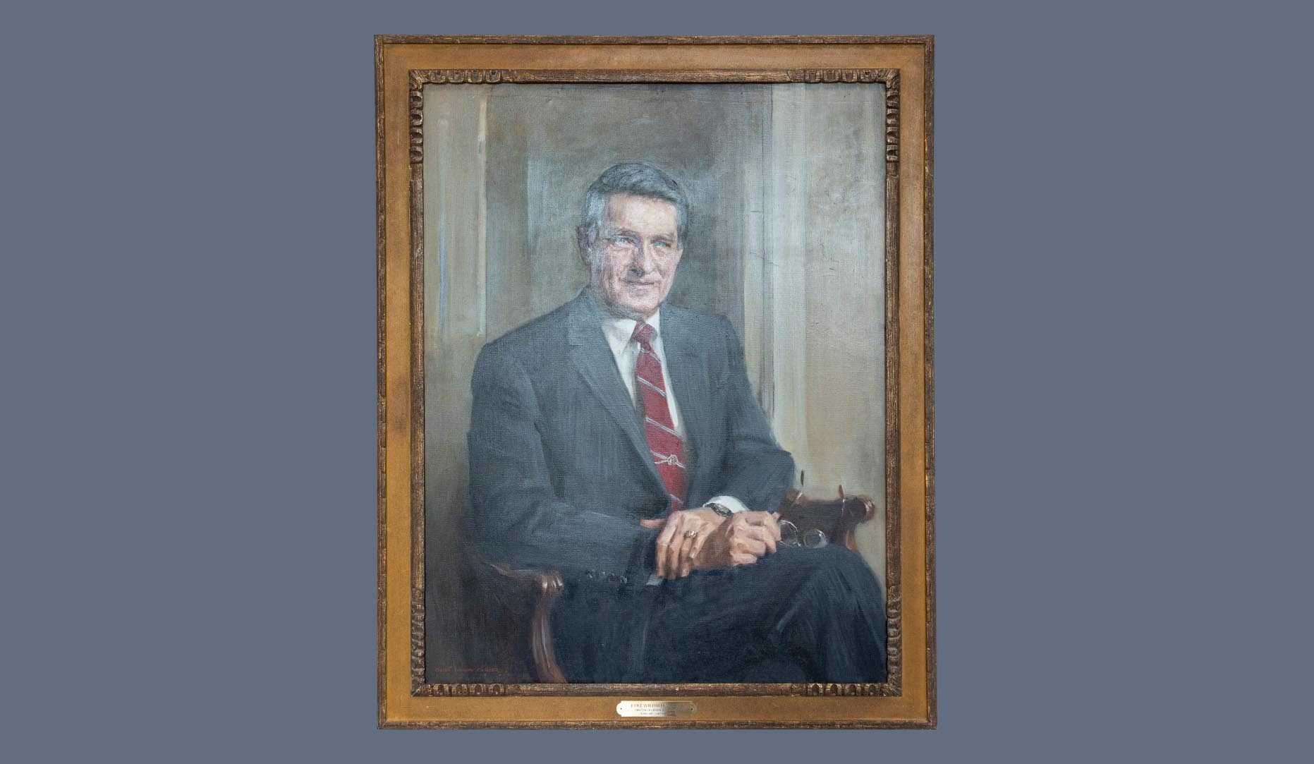 A portrait of former CIA director William H. Webster in a gold frame.