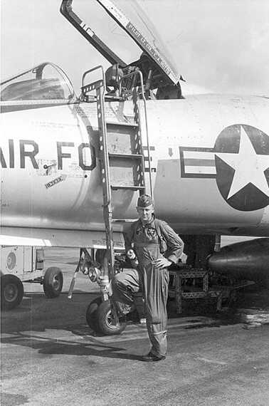 Carl Overstreet standing outisde of a plane.