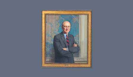 A portrait of former CIA director R. James Woolsey in a gold frame.