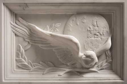 A close up of the eagle, laurel wreath, and moon.