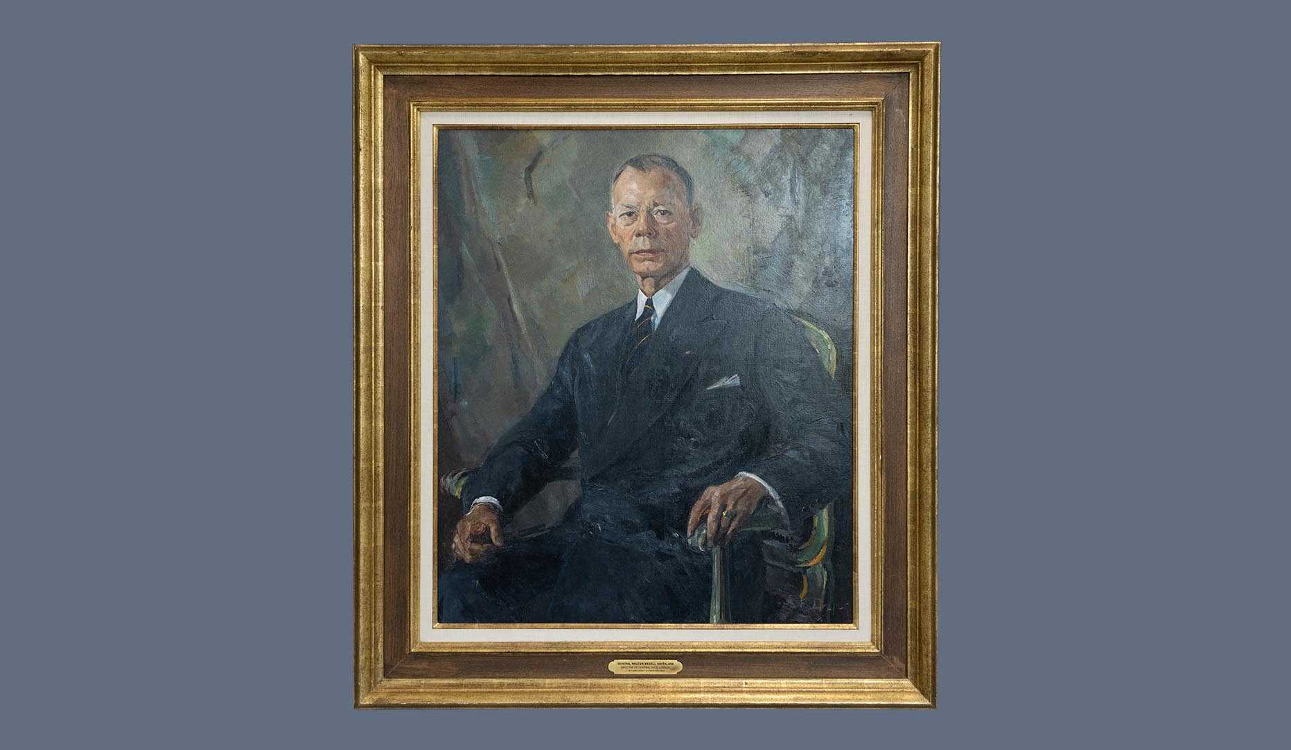 A portrait of former CIA director Walter B. Smith in a gold frame.