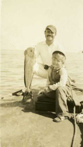 Ernest and Jack Hemingway holding up a fish.