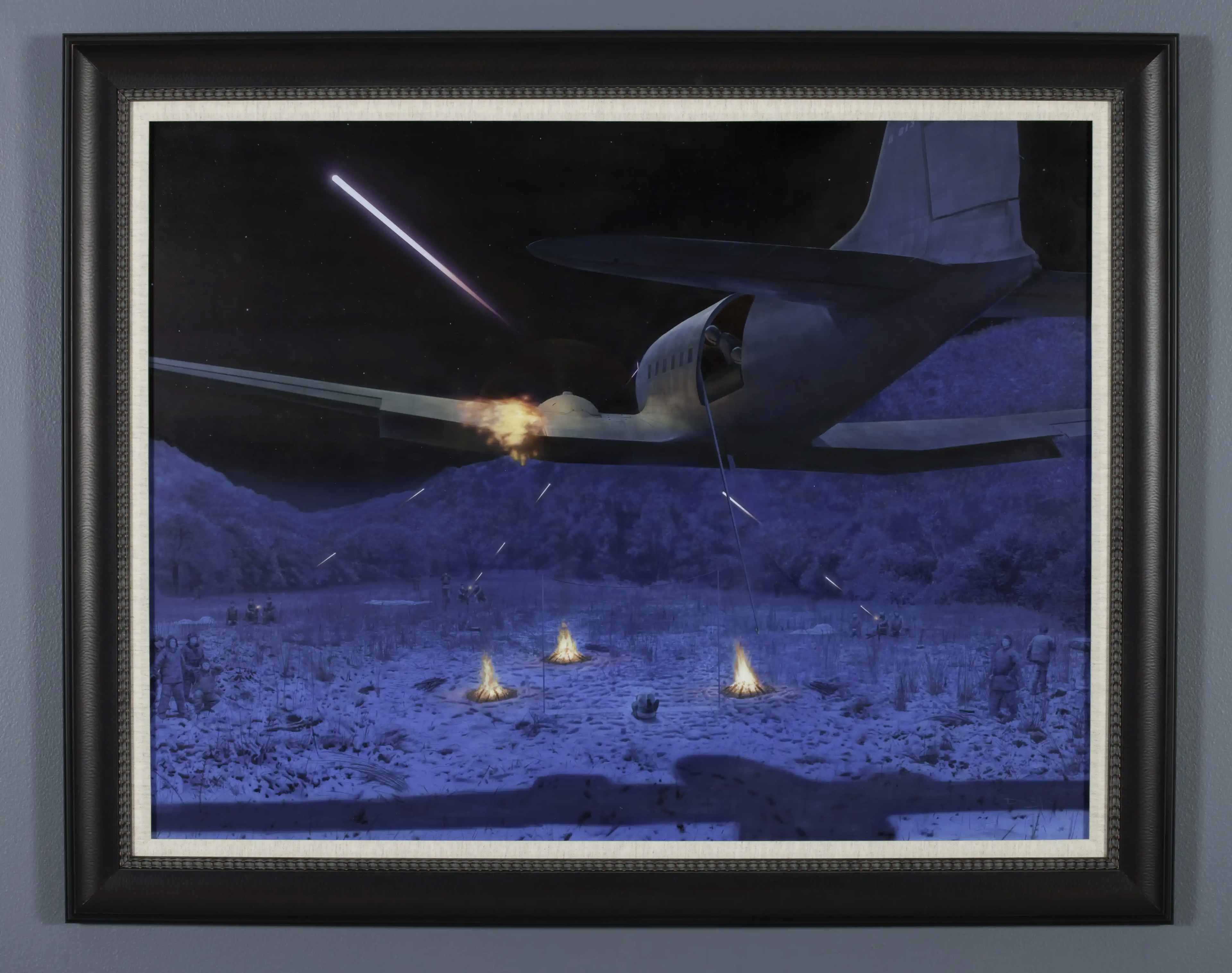 A painting of the C-47 aircraft being ambushed with gunfire from the ground
