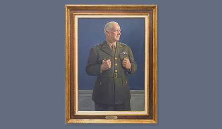 A portrait of former CIA director William J. Donovan in a gold frame.