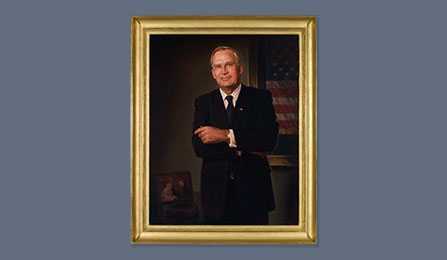 A portrait of former CIA director Porter J. Goss in a gold frame.