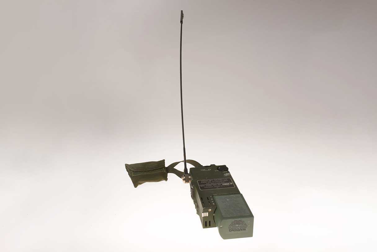 A small green hand held radio with a Global Positioning System receiver