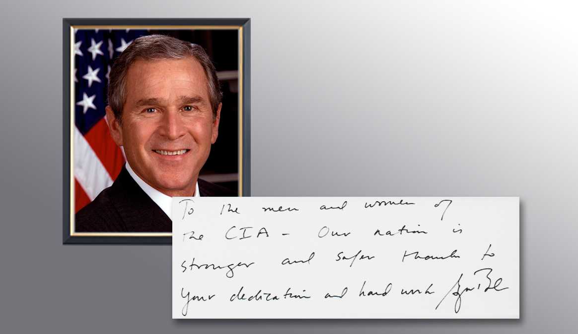 A picture of President George W. Bush and a handwritten note from him thanking the CIA for their services.