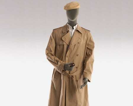 A well dressed male mannequin with a variety of concealed surveillance devices hidden on its person