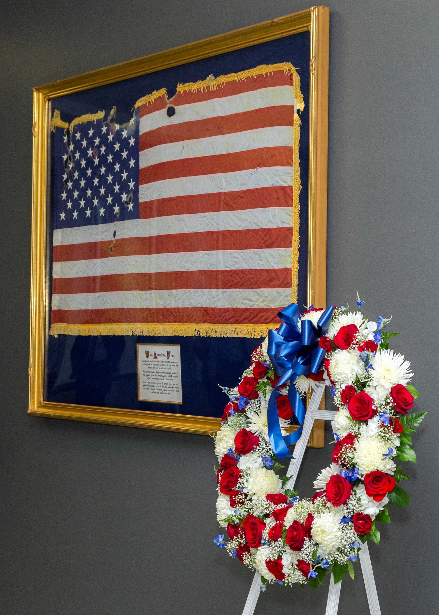 Image of a framed flag that was present during the 9/11 Attacks.