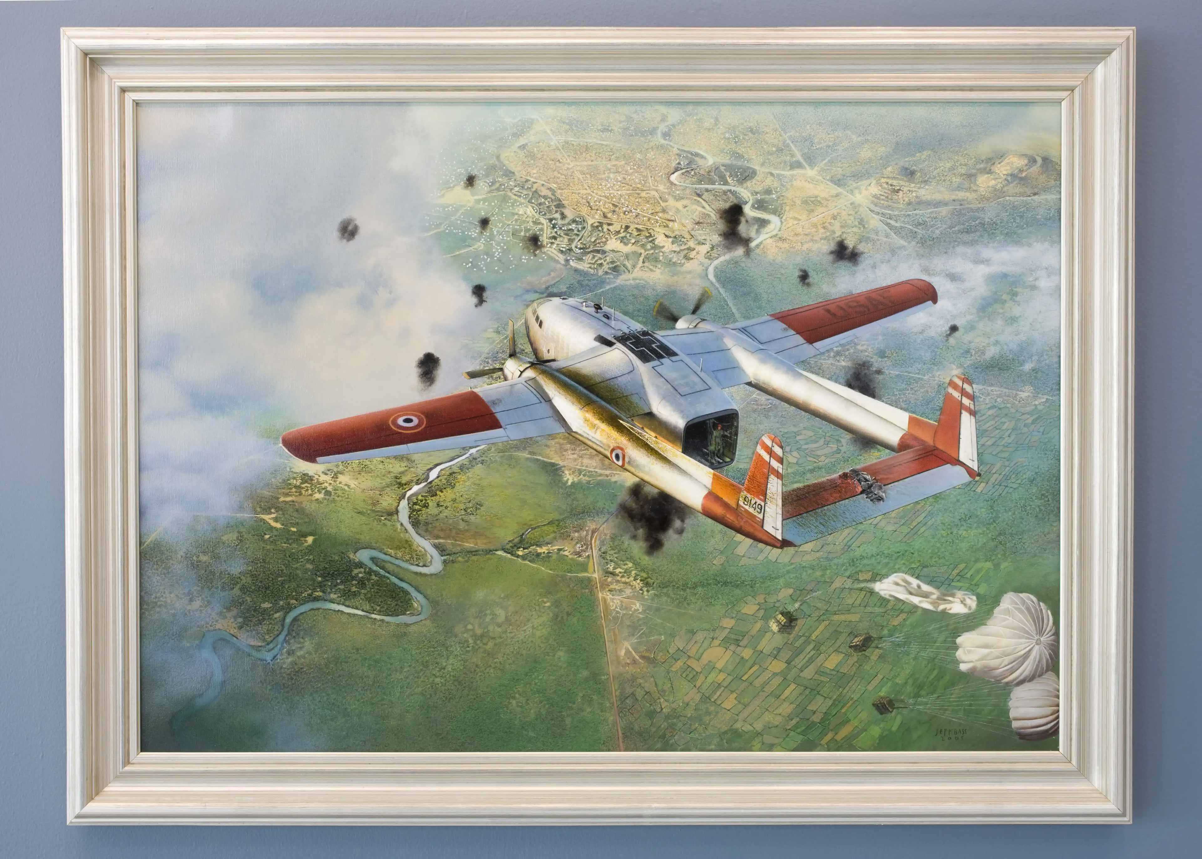 A painting of a damaged and smoking Civil Air Transport plane with parachuted supplies dropping to the ground