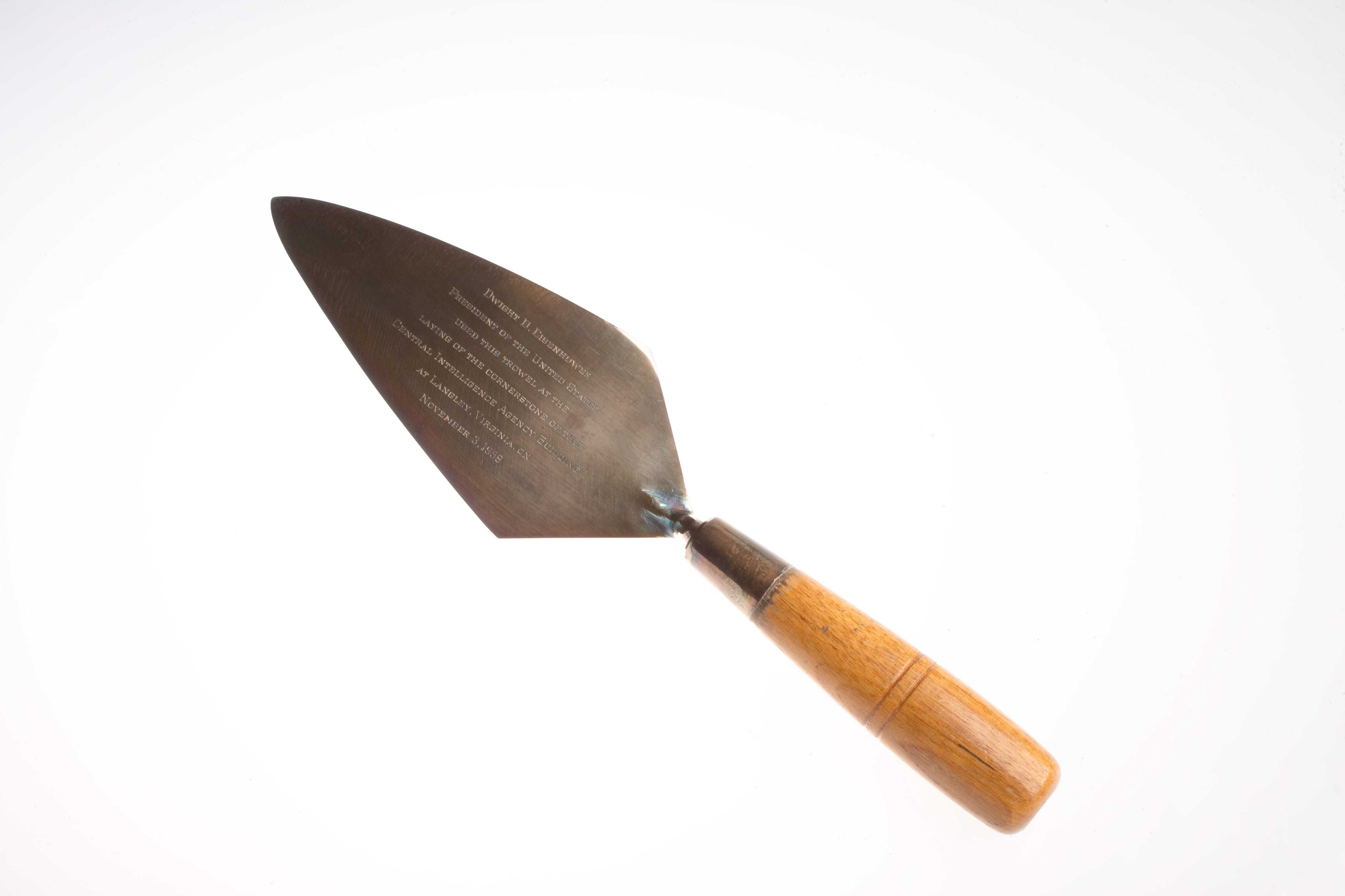 A trowel engraved with details about the day President Eisenhower laid the cornerstone at Langley
