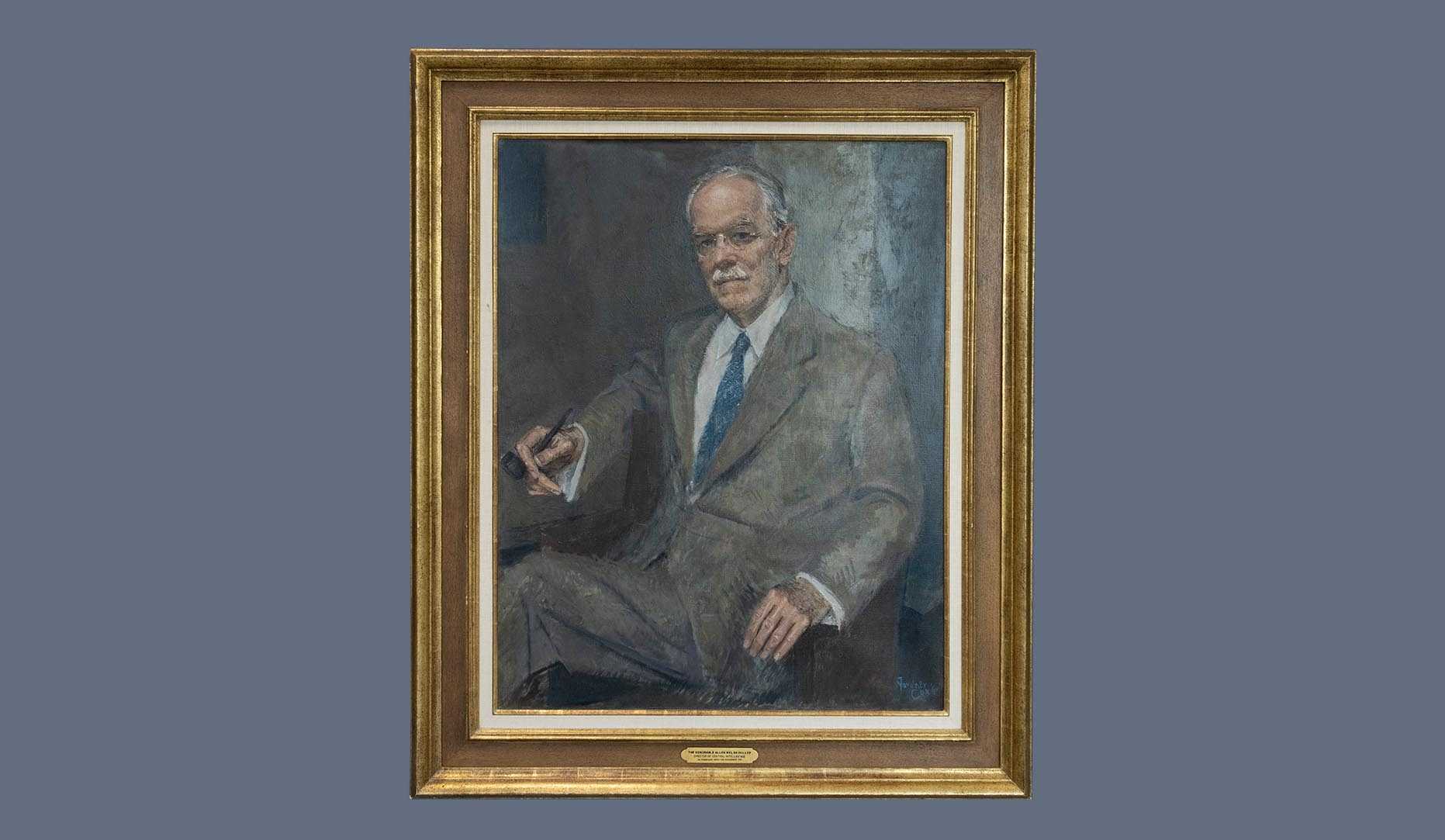 A portrait of former CIA director Allen W. Dulles in a gold frame.