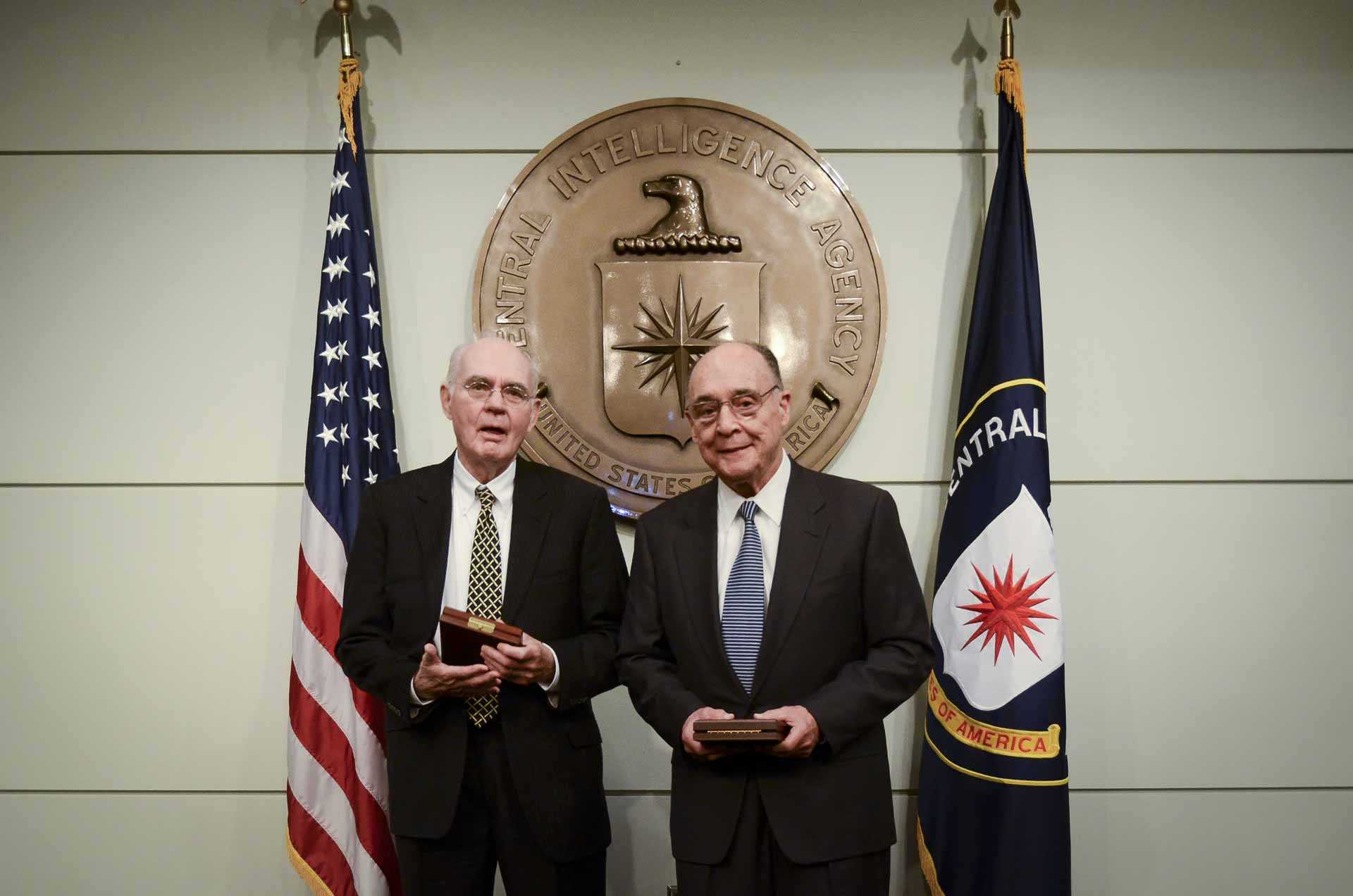 Photo of Downey and Fecteau receiving the Distinguished Intelligence Cross at CIA Headquarters in 2013.
