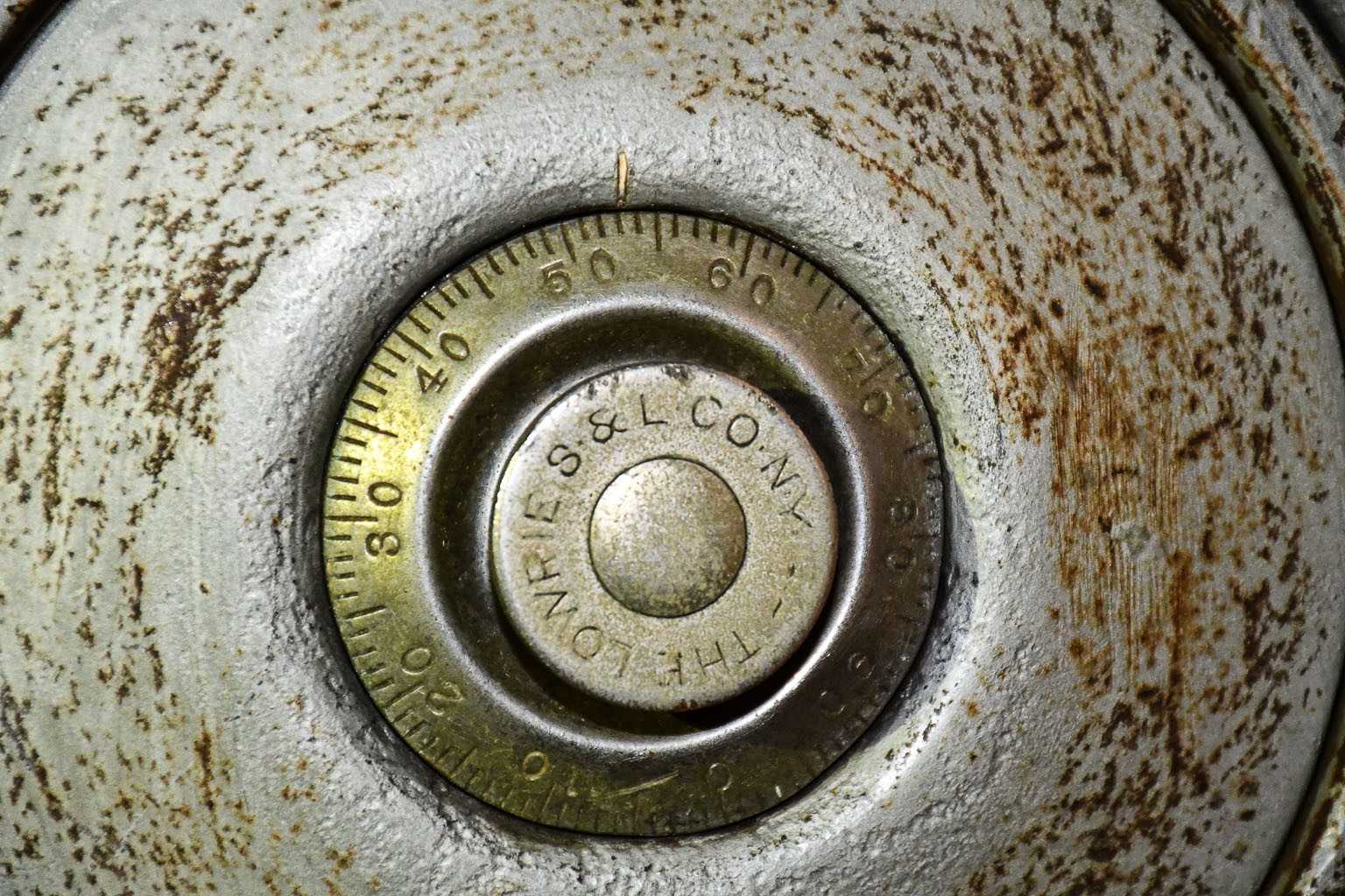 rusted safe dial from WWII-era