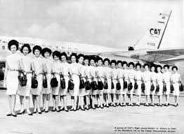 CAT stewardesses lined up outside a plane.