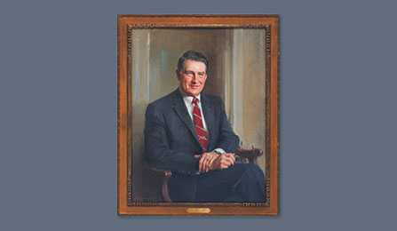 A portrait of former CIA director William H. Webster in a gold frame.