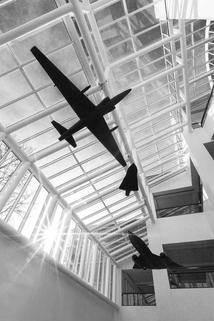 Grayscale photo of a view of the atrium at CIA Headquarters, where the impromptu brass quartet played Christmas carols.