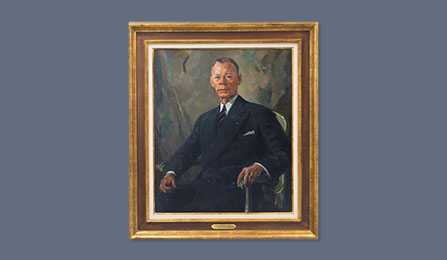 A portrait of former CIA director Walter B. Smith in a gold frame.
