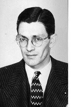 A black and white headshot of James Angleton.