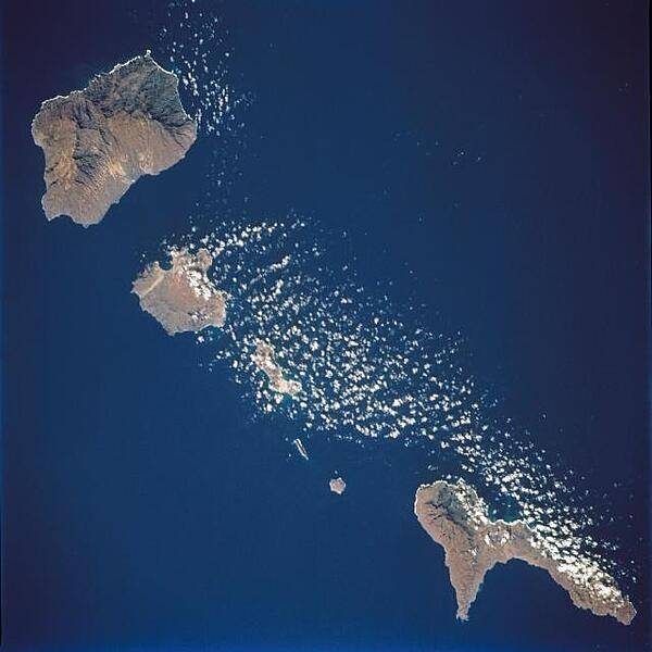 A space shuttle photo showing several of the northwestern islands in the Cape Verde chain in the North Atlantic Ocean, some 800 km (500 mi) from the coast of Senegal, Africa. From the upper left to lower right (northwest to southeast) one can see Santo Antao, Sao Vicente, Santa Luzia, Branco, Razo, and Sao Nicolau. Image courtesy of NASA.