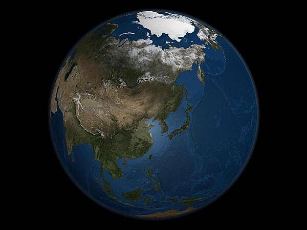 A global view of Asia on 21 September 2005, the day on which Arctic Sea ice was at its minimum extent for the year. Land areas display the average seasonal landcover from September 2004. Image courtesy of NASA.