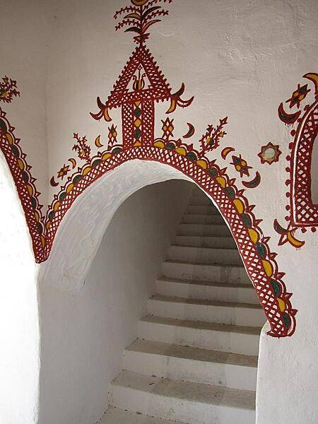 The traditionally decorated mud brick architecture of Ghadames&apos; Old City is designed for natural cooling. Buildings are built directly adjacent to each other, which insulates the streets and living spaces below from the beating sun.