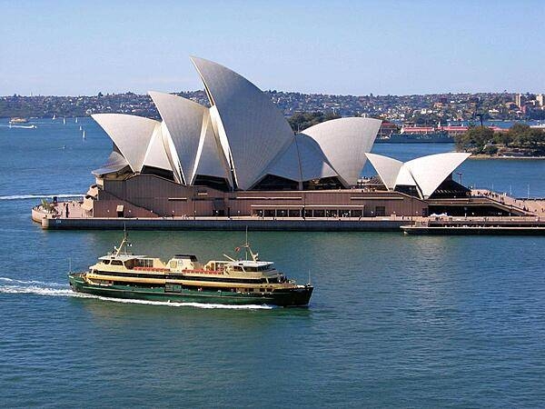 The Manly Ferry cruises past the Sydney Opera House.