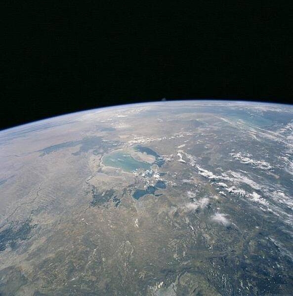 The Aral Sea, on the border between Kazakhstan and Uzbekistan, has diminished dramatically since the 1950s when its water was diverted for unfettered irrigation. By 2000, when this photo was taken, the surface area of the Aral had decreased by about two-thirds, and its volume by more than 80 percent. Today, only three lakes remain (covering less than 10 percent of the former surface area) and only one of these, the North Aral Sea (the deep blue area toward the bottom), has been partially restored. Image courtesy of NASA.