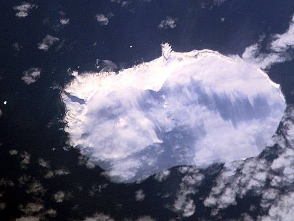Aerial photo of glacier-blanketed Bouvet Island. Image courtesy of NASA.