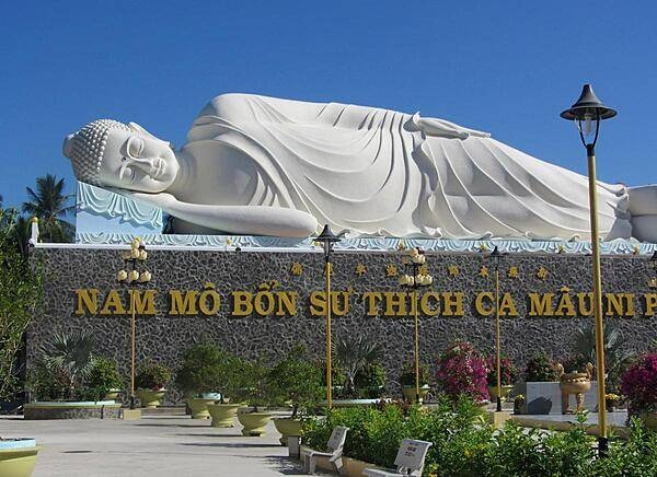 Reclining Buddha at Vinh Trang Pagoda near the city of My Tho. First completed in 1851, the Vinh Trang temple has been reconstructed a number of times.