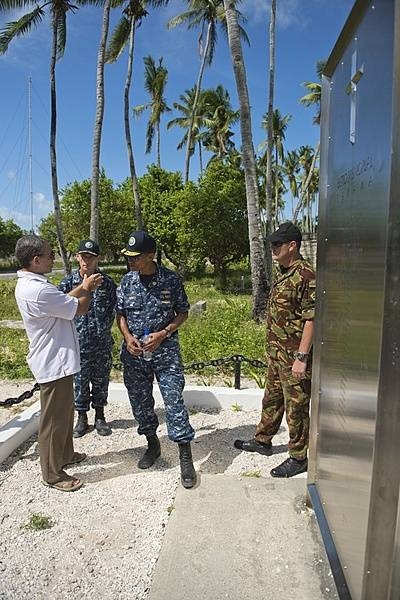 New Zealand High Commissioner of Tarawa Michael Wehi Mailetonga Walsh explains the Betio Memorial to Adm. Cecil D. Haney, commander of the US Pacific Fleet, during his visit to the Republic of Kiribati for Pacific Partnership 2013, 17 July 2013. The memorial is to 22 New Zealand, British, and Australian coastwatchers held prisoner and murdered by Imperial Japanese forces on Betio Island, Tarawa atoll, Kiribati. Photo courtesy of the US Navy/ Mass Communication Specialist 2nd Class Carlos M. Vazquez II.