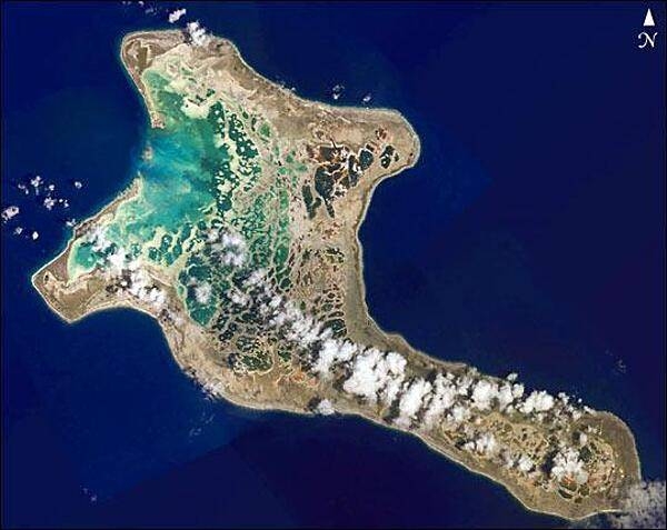 Pronounced &quot;Ki-ris-mas,&quot; Kiritimati Island has a large infilled lagoon that gives it the largest land area of any atoll in the world. Captain Cook named the atoll Christmas Island when he arrived on Christmas Eve in 1777. Used for nuclear testing in the 1950s and 1960s, the island is now valued for its marine and wildlife resources. It is particularly important as a seabird nesting site, with an estimated 6 million birds using or breeding on the island, including several million Sooty Terns. Rainfall on Kiritimati is linked to El Nino patterns, with long droughts experienced between the wetter El Nino years. This image is a mosaic of four digital photographs taken on 16 January 2002 from the Space Station. Photo courtesy of NASA.