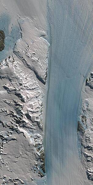 Byrd Glacier is a major glacier in Antarctica; it drains an extensive area of the polar plateau and flows eastward between the Britannia Range and the Churchill Mountains to discharge into the Ross Ice Shelf. This satellite image is courtesy of NASA.