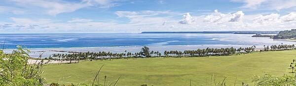 Panoramic view of Asan Bay and part of the War in the Pacific National Historical Park. In July 1944, Asan Bay was the site of the northern invasion landing area on the west coast of Guam. The 3rd Marine Division landed in this area with an objective of seizing the high ground behind the beach area. Photo courtesy of the US National Park Service.