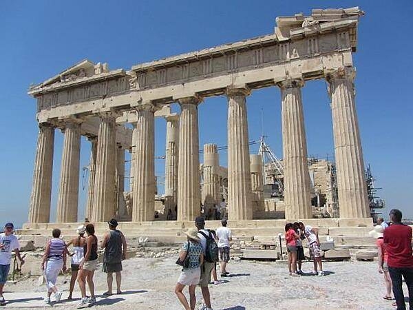 View of the rear of the Parthenon on the Acropolis in Athens. The temple, dedicated to the goddess Athena, was built between 447 and 438 B.C. The Acropolis is a citadel on a flat, high, rocky outcrop 150 m (490 ft)above sea level and is the highest point in Athens. It preserves a number of ancient structures.