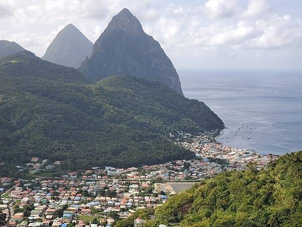 Another view of the Twin Pitons showing more of the town of Soufriere in the foreground.