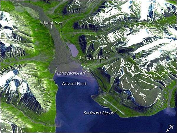 Spitsbergen, the largest of the islands in the Svalbard Archipelago, sits well inside the Arctic Circle, just south of 80 degrees north latitude. This image of the island and its topography was captured by NASA&apos;s Terra satellite. The rugged mountains are capped with snow and glaciers, with only the river valleys and low elevations supporting vegetation. Braided, shallow rivers filled with glacial sediment occupy the valleys. The vertical scale is exaggerated by a factor of two to emphasize the rugged terrain. The small town of Longyearbyen serves as the capital; its small airport provides the most northerly public airline service on earth. Although coal mining is still an important economic activity on the frigid island, scientists have recently become as interested in what can be tucked away in the frozen mountains of Spitsbergen as what can be extracted from them. In late February 2008, Norway accepted the first deposit for a so-called &quot;Doomsday&quot; agricultural seed vault, drilled deep into the mountains overlooking the Svalbard Airport. Financed by Norway, the Svalbard Global Seed Vault will safeguard seeds of human food crops from all over the world in the event a natural or human-caused catastrophic event would threaten the human food supply. Photo courtesy of NASA.