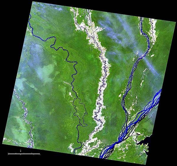 Because of its geographic isolation, the Cuvette Region in the northern part of the Republic of the Congo relies on rivers for transportation. From left to right, the Sangha, Likouala-aux-Herbes, Ubangi, and Congo Rivers are shown in this satellite photo. Agricultural plots dot the landscape. Crops grown in the Cuvette Region include cassava, bananas, plantains, pulses, and groundnuts. Image courtesy of NASA.