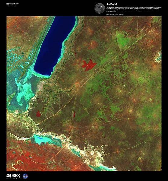 The intricate lines angling and criss-crossing over the landscape are roads in extreme southwestern Kazakhstan. The turquoise areas on the left of this false-color satellite image are salt flats and marshes, some parts of which are submerged (dark blue). The body of water is Sor Kaydak, which was once a gulf of the Caspian Sea. As water levels have dropped, curious patterns in the landscape have emerged that reveal old tributaries. Image courtesy of USGS.