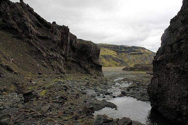 Mini stream between banks of eroding basalt in Thingvellir National Park.