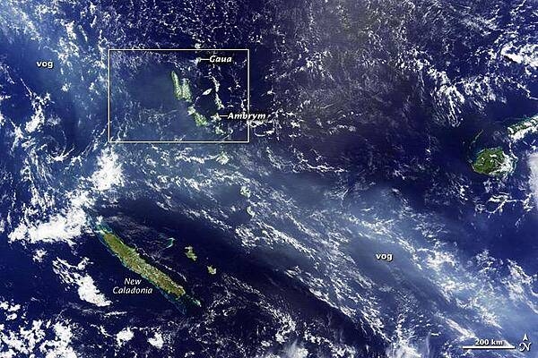 A thick blue haze stretches over the South Pacific archipelago of Vanuatu on the morning of 12 April 2010. The haze is volcanic fog - vog - emitted by the Gaua and Ambrym Volcanoes. Both are known for producing volcanic plumes rich in sulfur dioxide. This gas reacts with moisture in the air to create small droplets (called aerosols) of sulfuric acid, which scatters blue light, coloring the plume. This overview image shows the plume extending for thousands of kilometers to the northwest (upper left) and southeast (lower right) of the islands. Photo courtesy of NASA.