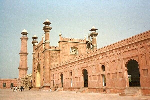 The entrance to the Badshahi Mosque, or “imperial mosque,” as viewed from the mosque courtyard. The mosque, built by the Mughal emperor Aurangzeb from 1671-1673, is the last great mosque built during the Mughal period; its courtyard can accommodate 100,000 worshipers. The gateway leads out to the garden known as Hazuri Bagh, beyond which is the Alamgiri gate of the Lahore Fort.