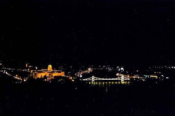 Budapest at night. The beautiful Szechenyi Chain Bridge links Buda on the left with Pest on the right.